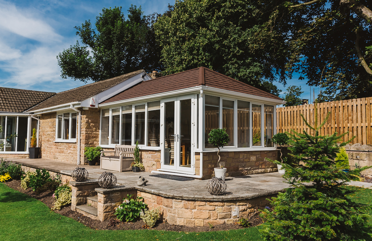Customer solid roof conservatory in summer